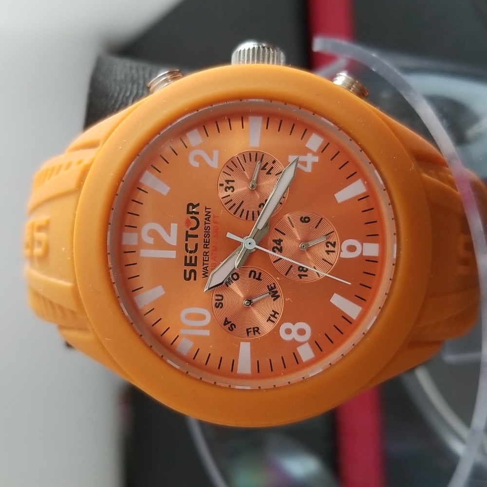 Sector men watch.  Orange rubber band.  New with original tag and box.